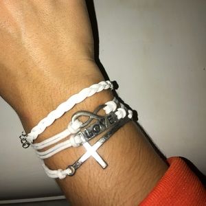 White bracelet with charms on it.